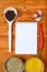 Copyspace food frame with notepad paper spices and cooking accesories