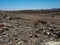 Copyspace of hard life showing rock mountain dried dusty landscape ground of Namib desert with splitting shale pieces