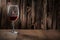 Copyspace view wineglass with red wine on vintage wooden background