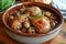 Coq au Vin: A rich, rustic stew featuring chicken simmered in red wine with mushrooms and onions.