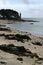 Coq beach and lighthouse at low tide in Benodet