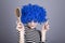 Coquette blue-hair girl with comb.