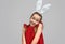Coquettish little girl in bunny ears