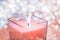 Coral aromatic candle on Christmas and New Years glitter background, Valentines Day luxury home decor and holiday season brand