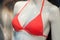 coral color bikini on mannequin in fashion store showroom for women