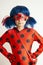 Corby, United Kingdom. March 12, 2019 - little girl in Ladybug Myraculous cosplay costume. Superhero ladybug with blue twig,