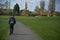 Corby, United Kingdom. March 13, 2019 - Old man walking in the autumn park. Copy space