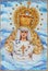 Cordoba - The ceramic tiled, cried Madonna on the facade of church Iglesia de Nuestra Senora de Gracia