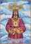 Cordoba - The ceramic tiled Jesus Christ as the priest on the facade of church Iglesia de Nuestra Senora de Gracia