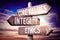 Core values, integrity, ethics - wooden signpost, roadsign with three arrows