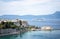 CORFU, GREECE - 10.09.2019 - Faliraki beach Alecos Baths public bathing spot with rock and pier ans restaurant in Corfu