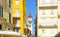 Corfu, Greece.  Clock Tower of the Church of Agios Spiridon.  Framed amount colorful old buildings in Old town