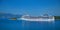 CORFU ISLAND, GREECE, JUN,06, 2014: View on giant amazing white touristic passenger liner in Ionian Sea. MSC FANTASIA cruise liner