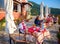 CORFU ISLAND, GREECE, JUNE 03, 2014: Young pretty woman is having dinner in classical Greek taverna restaurant cafe. Tourists and