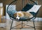 Corgi puppy sitting on chair. Cute puppy poses for the camera