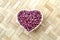 Coriander seeds in bowl heart