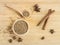 Coriander seeds in wooden bowl and on wooden board.