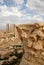 Corinthian carved capital and ruins of Palmyra