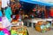 Corinto, Nicaragua- Oct 10, 2018. Tourists browsing at Shops with Colourful Goods, Clothes, T shirts, Souvenirs.