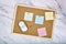 Cork board pin with blank sticky note, Post it adhesive paper for office memo