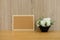 cork board white artificial flower on wooden table at office