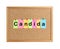Cork board with word Candida made of colorful notes on white background