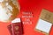 Cork globe with red pins, blank mockup calendar and passports with ticket and text `Travel around the world`