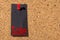 Cork panel. Red thumbtack, black paper: Black Friday concept.