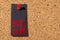 Cork panel. Red thumbtack, black paper: Black Friday concept.