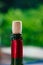 Cork plug on wine bottle with green defocused background