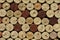 Cork wine bottle tops with numbers of years arranged densely to each other. Closeup