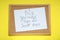 Corkboard with pinned message Big Journeys Begin With Small Steps on yellow background, top view. Motivational quote