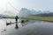 Cormorant, fish man and Li River scenery sight with fog in spring, Guilin, China