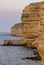 Cormorants rest on a steep bank of Pontic limestone in eastern Crimea