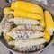 Corn boiling in pot.