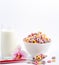 Corn cereal breakfast flake in children cups and milk is a healthy breakfast that is good for your body every day on a white