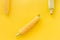 Corn on cobs on yellow background top view copyspace