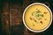 Corn cream soup with bacon chowder on wooden background.