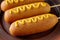 Corn dog street junk food deep fried hotdog meat sausage snack with mustard