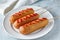 Corn dog traditional American corndog street junk food deep fried hotdog meat sausage snack with ketchup