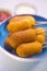 Corn dogs cooked with sausage and dough, close up
