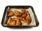 Corn fed chicken wings and drumstick in Asian style spicy marinated with herbs in a metal cooking tray. Uncooked chicken meat