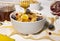 Corn Flakes Bowl with Honey, Banana, Berries and Wooden Spoon on white background, Healthy Breakfast, Delicious Food