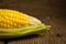 corn fresh on old wood and flower Plumeria. morning sun. beautiful corn. closeup header