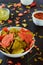 Corn Green and Red Tortilla crisps in the shape of a Christmas tree in white bowl with salsa, guacamole, cheese, sour