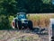 Corn harvest, corn forage harvester in action, harvest truck with tractor