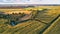 Corn harvest. September agriculture fields aerial panorama