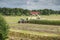 Corn harvest vehicles distant view phase 1