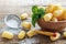 Corn sticks in a bowl and sieve with powdered sugar closeup.