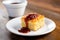 cornbread with bbq sauce on top on a white plate